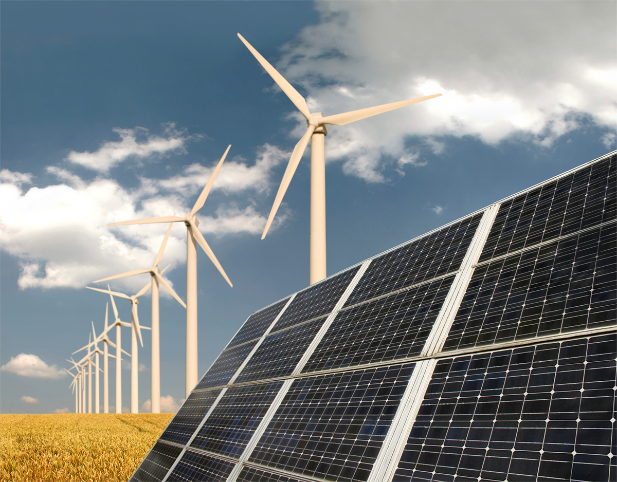 Solar panels and wind mills near prairie